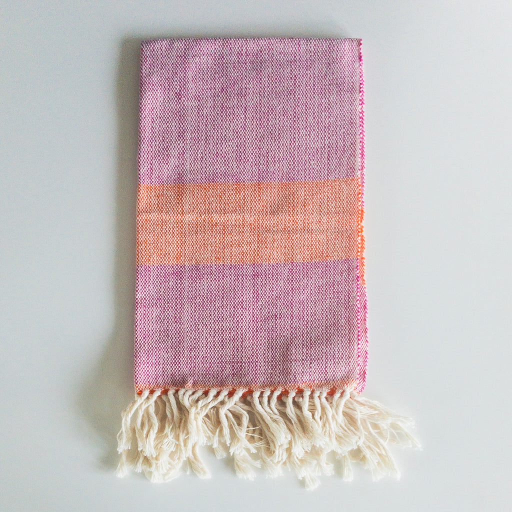 LIZABETH Hand Towel in sunrise handwoven by Living Threads Co. Partner artisans in Nicaragua in Fuchsia and Orange