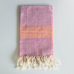 LIZABETH Hand Towel in sunrise handwoven by Living Threads Co. Partner artisans in Nicaragua in Fuchsia and Orange