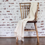 Handwoven herringbone 100% ecologically dyed cotton blanket by Living Threads Co. artisans in natural.