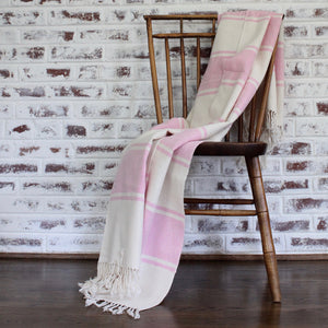 handwoven cotton AUDAZ blanket by Living Threads Co. artisans in pink