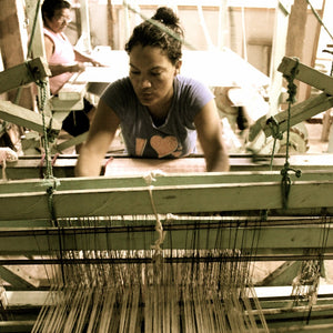 Living Threads Co artisan in Nicaragua working on handwoven cotton table runners