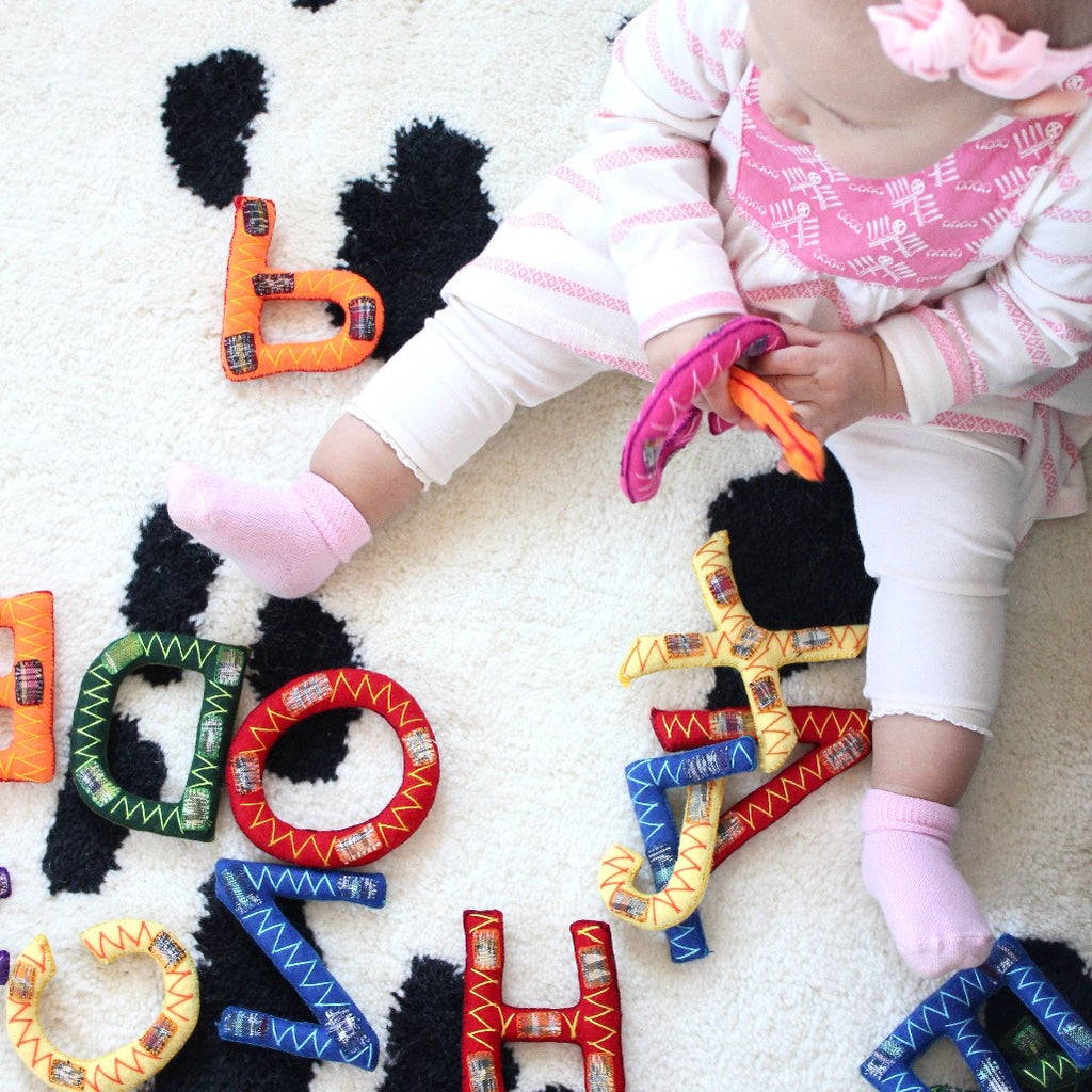 Hand Stitched soft alphabet sets by Living Threads Co. artisans for babies and children.