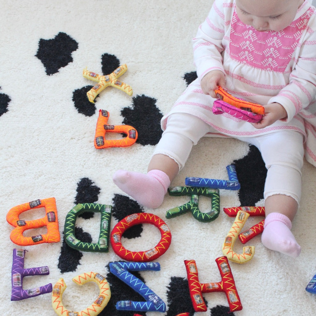 Hand Stitched alphabet sets by Living Threads Co. artisans for baby and children