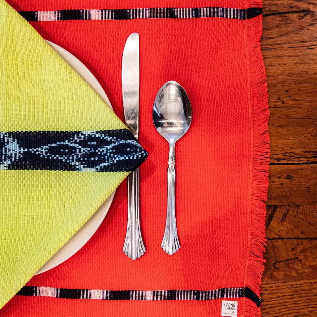 KAT Placemats in achiote handwoven and naturally dyed by Living Threads Co. Guatemalan artisans.