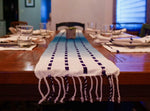 Living Threads Co. table runner in naturally dyed cotton. This blue table runner is made by partner artisans in Guatemala who use traditional techniques of dying and weaving to create unique pieces for the home. 