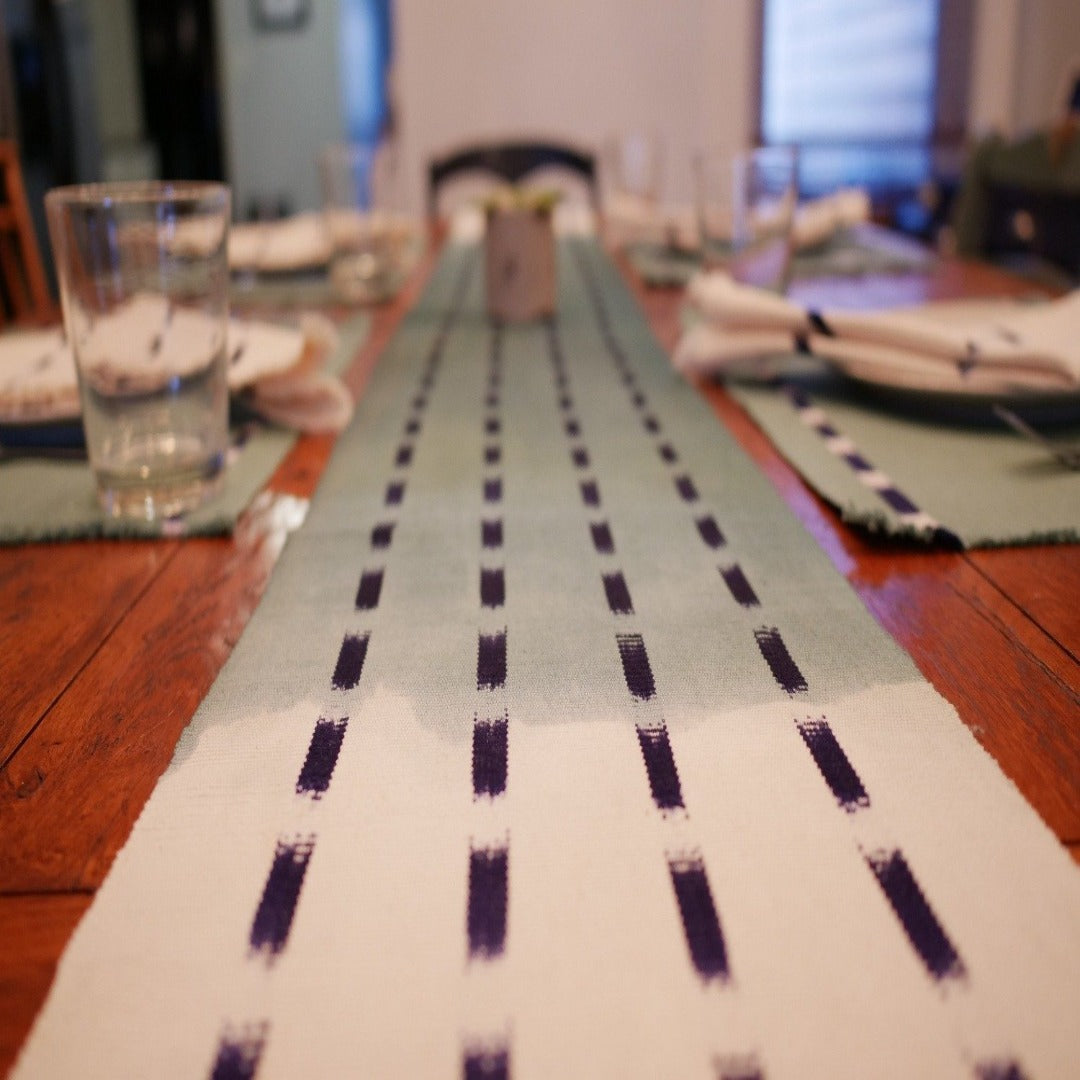 Living Threads co. naturally dyed cotton table runner. The ANAH runner is crafted by artisans in Guatemala using traditional dyeing and weaving techniques. 