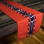 TAY Ikat Natural Dye table runner hand woven in Guatemala on Mayan backstrap loom by Living Threads Co. skilled artisans in bright orange Achiote