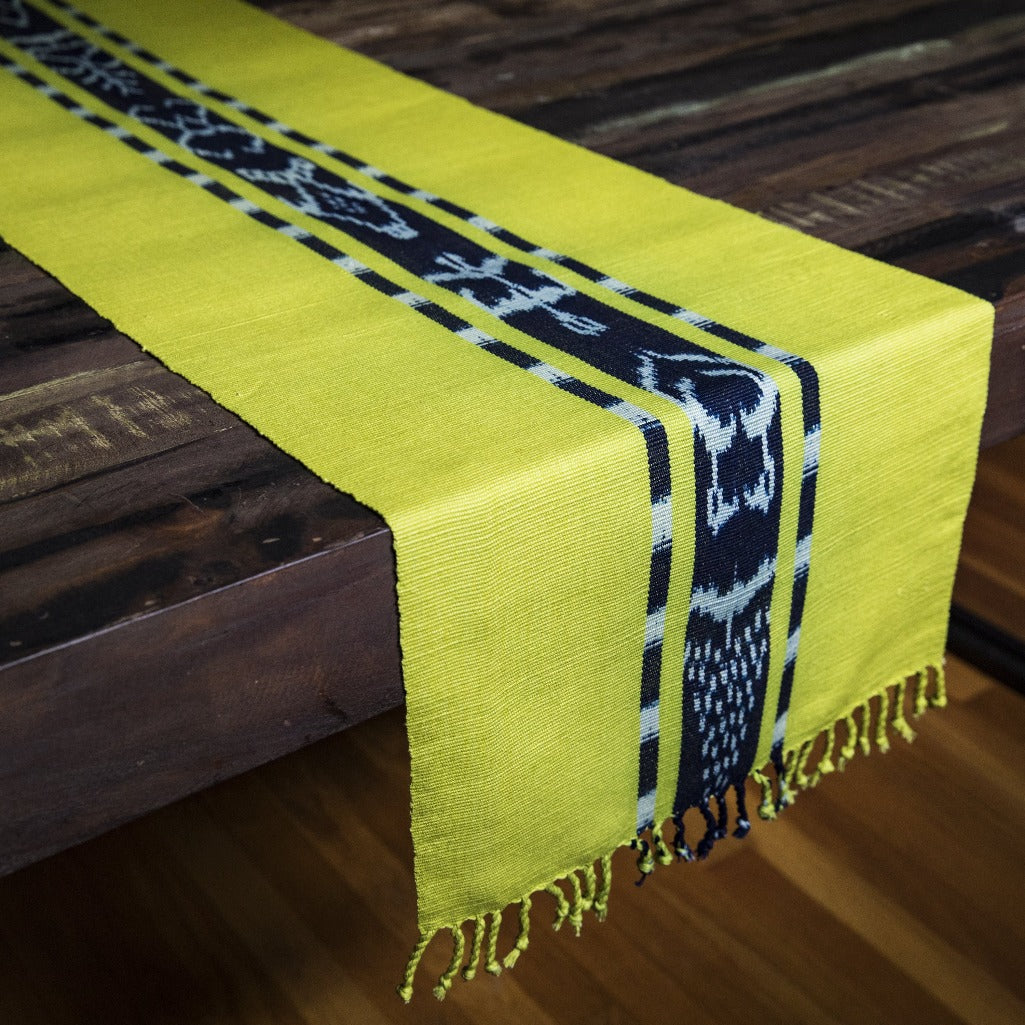 TAY Ikat naturally dyed table runner hand woven in Guatemala on Mayan backstrap loom by Living Threads Co. skilled artisans in Chartreuse