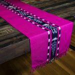 Handwoven naturally dyed TAY Ikat table runner in Pink made by Guatemalan partner artisans on a traditional Mayan backstrap loom.